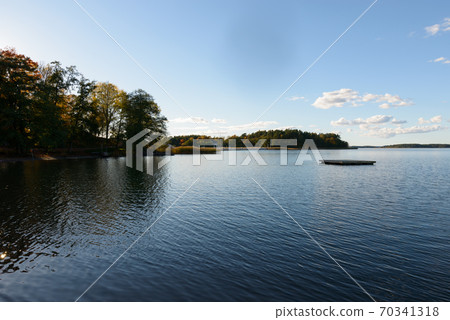 View of river and sky with autumn forest along the riverside 70341318