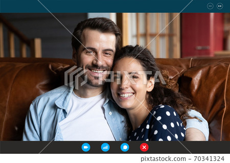 Screen view of happy couple have webcam call Screen view of happy couple have webcam call 70341324
