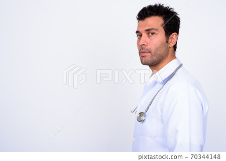 Handsome Turkish man doctor against white background Handsome Turkish man doctor against white background 70344148
