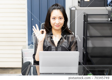 Woman using a laptop Woman using a laptop 70345749