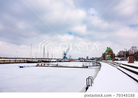 Winter time in the city port of Rostock, Germany Winter time in the city port of Rostock, Germany 70348188