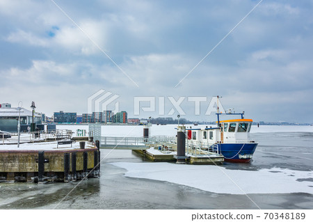Winter time in the city port of Rostock, Germany Winter time in the city port of Rostock, Germany 70348189