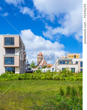 Modern buildings and old church in the city Rostock, Germany Modern buildings and old church in the city Rostock, Germany 70348205