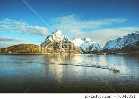 fishing boat and Reine Village, Lofoten Islands, Norway 70348351