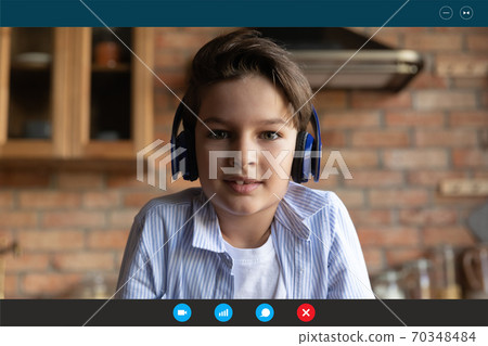 Little boy child in headphones talk on video call 70348484