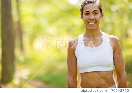 Female Athlete In Forest During Outdoor Workout Female Athlete In Forest During Outdoor Workout 70348700