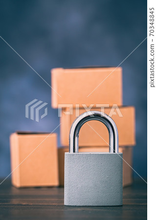 Metal lock in front of boxes 70348845