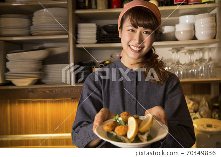 Clerk carrying clothes Clerk carrying clothes 70349836