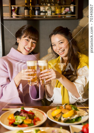A woman toasting 70349867