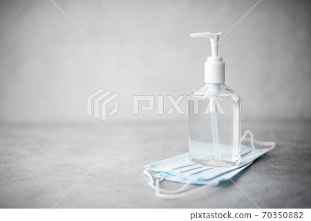antiseptic hand gel in a transparent plastic bottle and mask antiseptic hand gel in a transparent plastic bottle and mask 70350882