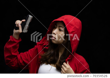 Portrait asian woman hand holding a pistol gun 70354526