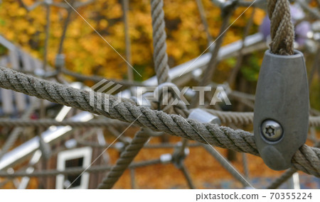 Rope climbing toys for kids in outdoor playground. Rope climbing toys for kids in outdoor playground. 70355224