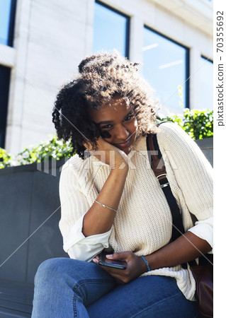 young pretty african girl posing cheerful on city background, lifestyle outdoor people concept young pretty african girl posing cheerful on city background, lifestyle outdoor people concept 70355692