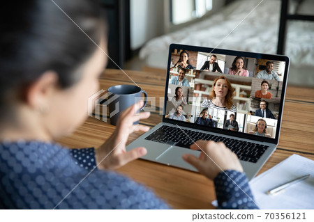 Woman talk on group video call with diverse colleagues Woman talk on group video call with diverse colleagues 70356121