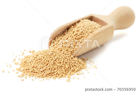 Dry yeast in a scoop on a white background. Isolated Dry yeast in a scoop on a white background. Isolated 70356950