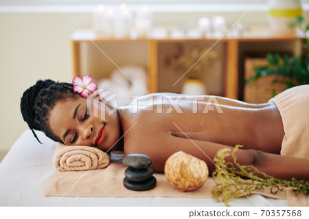 Woman resting after massage Woman resting after massage 70357568