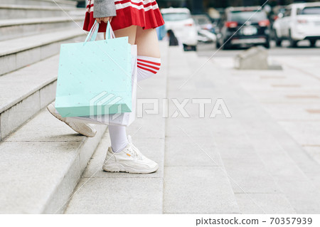 School girl leaving shopping mall 70357939