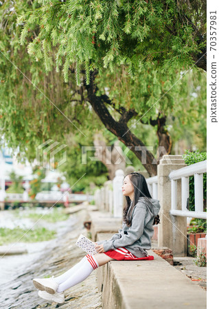 Pensive Korean schoolgirl 70357981
