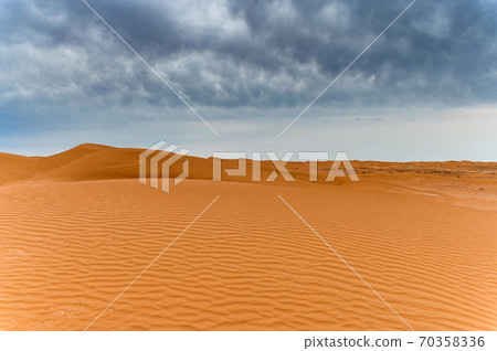 Picturesque desert landscape with dunes and dramatic sky Picturesque desert landscape with dunes and dramatic sky 70358336