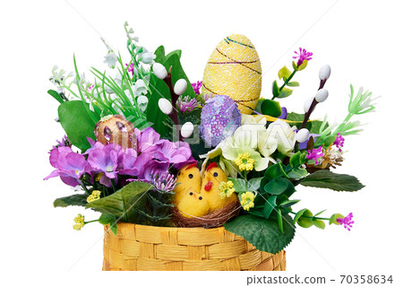 Easter basket from a flower arrangement on white background Easter basket from a flower arrangement on white background 70358634
