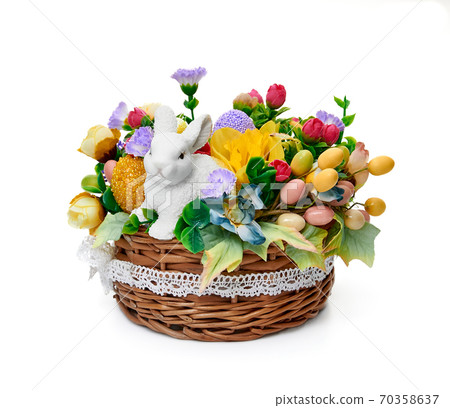 Easter basket from a flower arrangement on white background Easter basket from a flower arrangement on white background 70358637