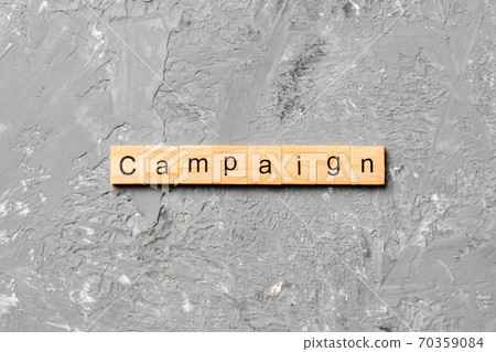 CAMPAIGN word written on wood block. CAMPAIGN text on cement table for your desing, concept CAMPAIGN word written on wood block. CAMPAIGN text on cement table for your desing, concept 70359084