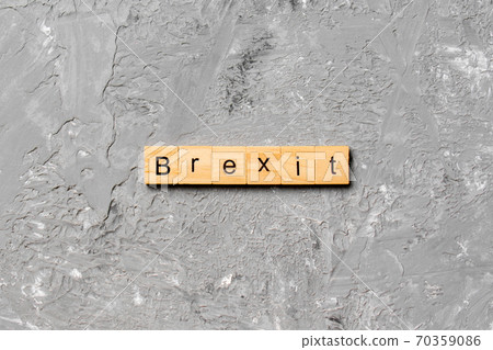 Brexit word written on wood block. Brexit text on cement table for your desing, concept Brexit word written on wood block. Brexit text on cement table for your desing, concept 70359086