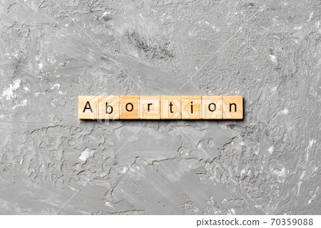 abortion word written on wood block. abortion text on table, concept 70359088