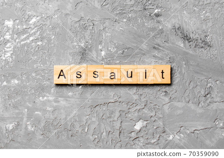 assault word written on wood block. assault text on table, concept assault word written on wood block. assault text on table, concept 70359090