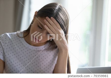 Frustrated young beautiful girl having financial problems. Frustrated young beautiful girl having financial problems. 70359981