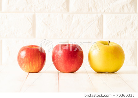 Three types of apples, white brick background, from Hokkaido and Aomori prefectures: Toki, Akane, and Santsugaru Three types of apples, white brick background, from Hokkaido and Aomori prefectures: Toki, Akane, and Santsugaru 70360335
