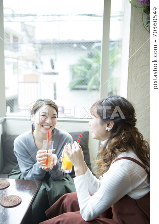 A woman talking in a cafe A woman talking in a cafe 70360549