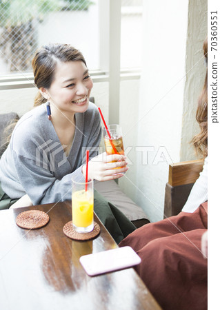 A woman talking in a cafe 70360551