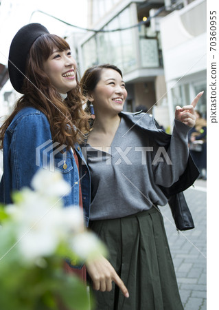 A woman walking in the city 70360955