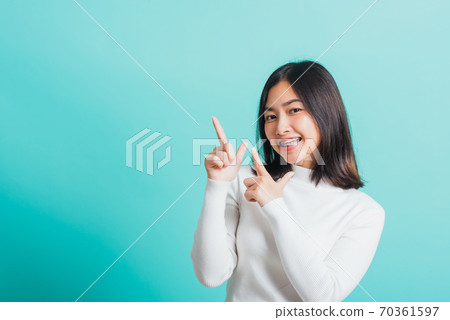 woman smile have dental braces on teeth laughing point finger side away 70361597