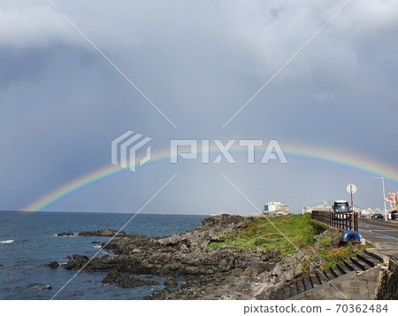 A rainbow over the sea of jeju island A rainbow over the sea of jeju island 70362484