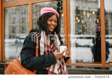 Elegant black girl in a winter city Elegant black girl in a winter city 70364578