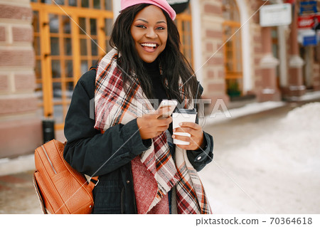 Elegant black girl in a winter city 70364618