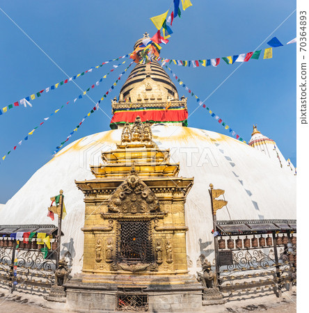 Tower of the Boudhanath Stupa decorated with flags in Kathmandu, Nepal. 70364893