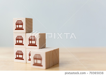 Wooden block on top with icon store 70365038