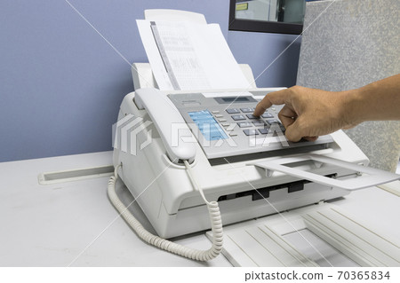 The fax machine use for Sending documents in the office, concept equipment needed in office The fax machine use for Sending documents in the office, concept equipment needed in office 70365834