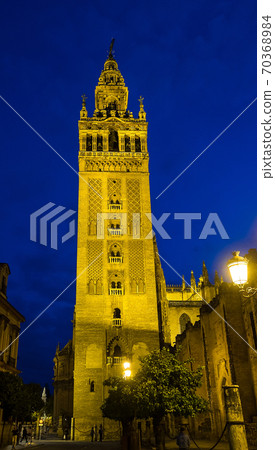 Bell Tower named Giralda in catholic Cathedral of Saint Mary in Seville, Spain Bell Tower named Giralda in catholic Cathedral of Saint Mary in Seville, Spain 70368984