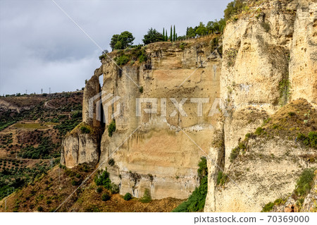 Scenic sight of Ronda with white houses built on high cliffs, Andalusia, Spain. 70369000