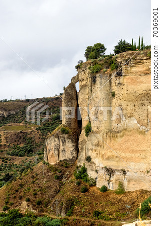 Scenic sight of Ronda with white houses built on high cliffs, Andalusia, Spain. 70369001