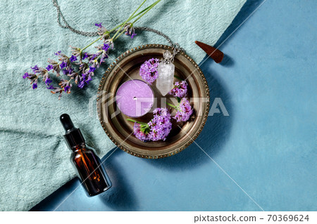Aromatherapy banner design with copy space. Incense cone, essential oil, scented candle, perfume vial, vervain and lavender, shot from the top with a place for text 70369624
