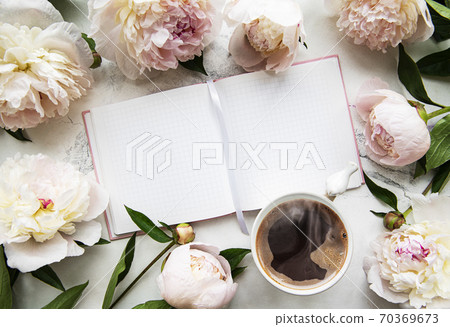 Peony flowers, notebook and coffee 70369673