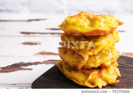 Fried cakes of grated potatoes on the plate with sauce. Traditional pancakes boxty raggmunk. 70370880