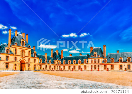 FONTAINEBLEAU, FRANCE - JULY 09, 2016 :Suburban Residence of the France Kings - beautiful Chateau Fontainebleau and surrounding his park. FONTAINEBLEAU, FRANCE - JULY 09, 2016 :Suburban Residence of the France Kings - beautiful Chateau Fontainebleau and surrounding his park. 70371134