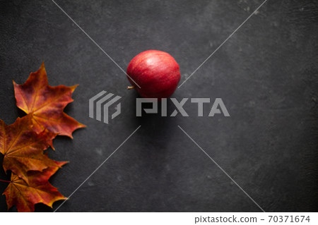 Autumn marple leaves and Ripe garden red apples Autumn marple leaves and Ripe garden red apples 70371674