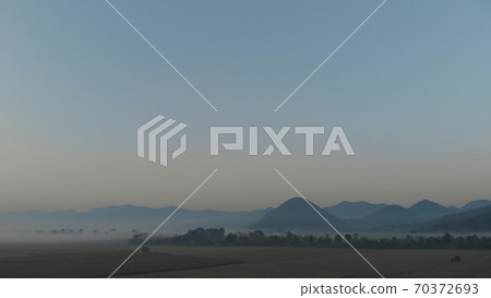 Scenery of gloomy mountain peaks. 70372693